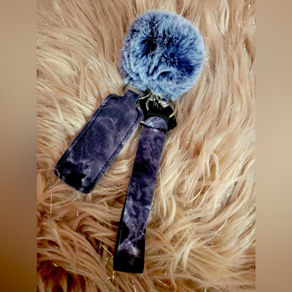 Black and white smokey effect chapstick holder wristlet with fuzzy ball